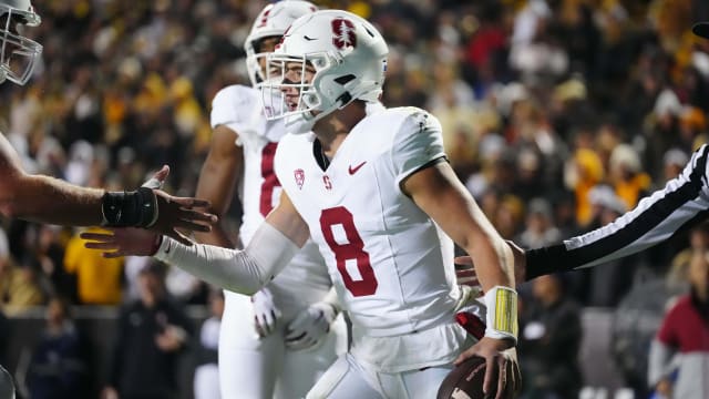 Oct 13, 2023; Boulder, Colorado, USA; Stanford Cardinal quarterback Justin Lamson (8) celebrates his 1 yard touchdown carry in the third quarter against the Colorado Buffaloes at Folsom Field. Mandatory Credit: Ron Chenoy-USA TODAY Sports